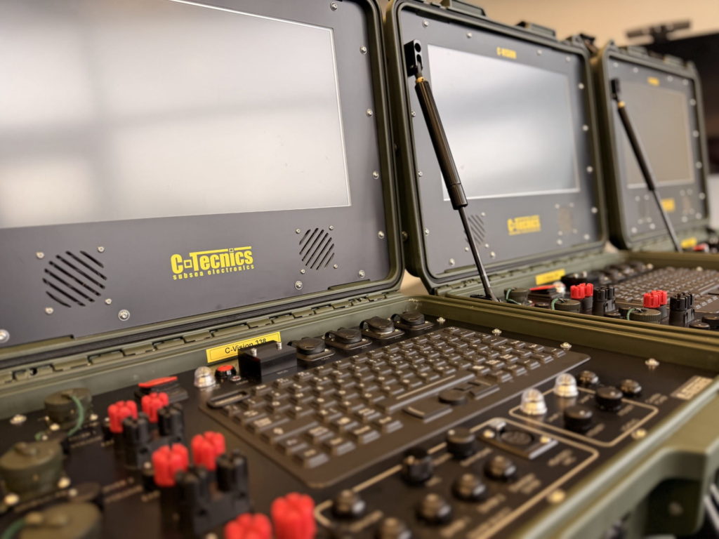 Close-up angled view of C-Vision Encrypt control interface highlighting keyboard, power controls, and sealed connection ports.